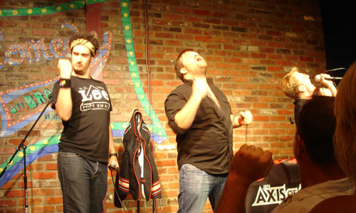 The Axis of Awesome reaching for the power chord