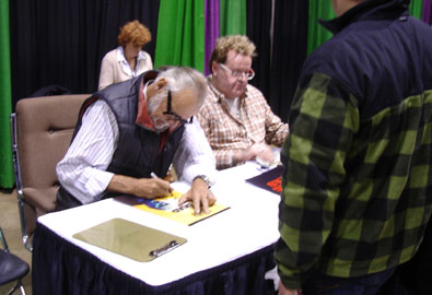 George Romero signs for a fan